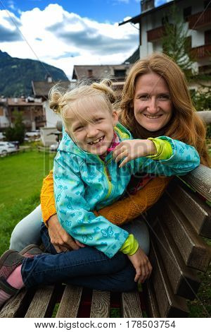 happy family. mother with daughter in a park in Canazei Italy