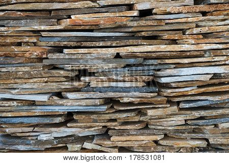 Texture, background, decorative flagstone stacked in a pile