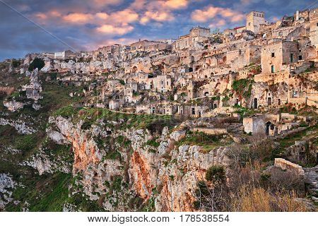 Matera, Basilicata, Italy: landscape at sunrise of the old town (sassi di Matera), with the houses carved into the tufa rock over the deep ravine