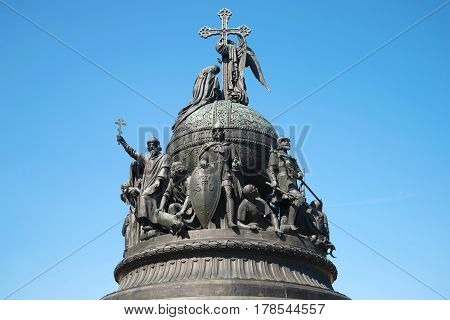 Top of the monument "Millennium of Russia" (1862) closeup on background of blue sunny sky. Veliky Novgorod, Russia