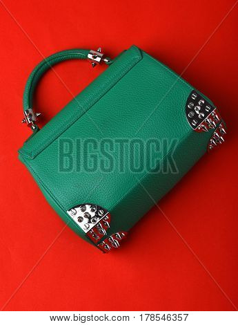 Small Womans Leather Green Bag With Metallic Spikes On Red
