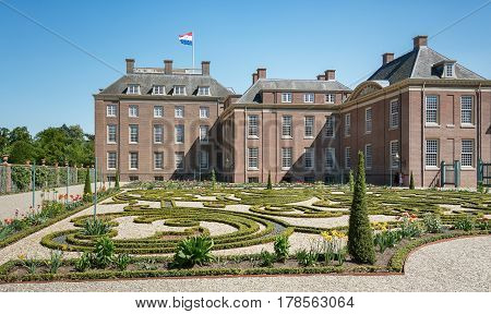 Apeldoorn The Netherlands May 8 2016: Dutch baroque garden of The Loo Palace a former royal palace and now a national museum located in the outskirts of Apeldoorn in the Netherlands