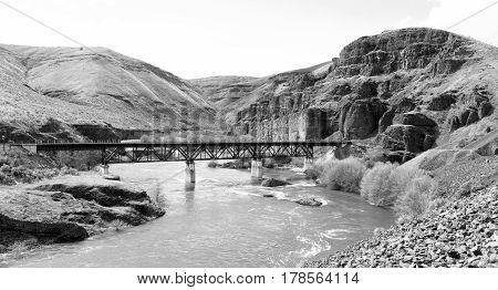 A Railroad Tressle Bridge spans the Deschutes River in Oregon State USA North America