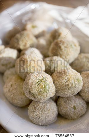 preparing stuffed fried olives called Ascolana olives