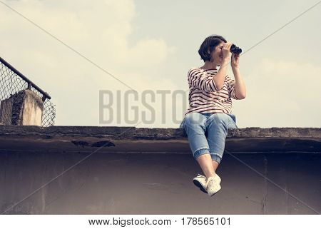Woman using binocular explore searching