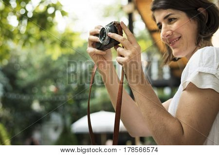 Woman traveler photographer holiday lifestyle trip