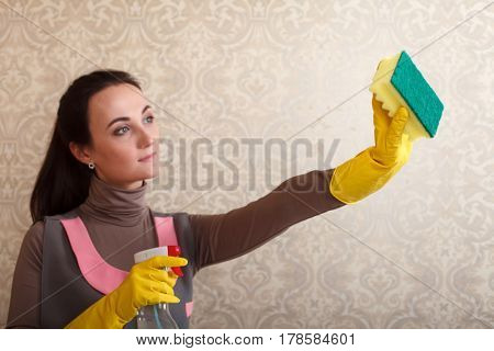Cleaning servisce lady in rubber gloves