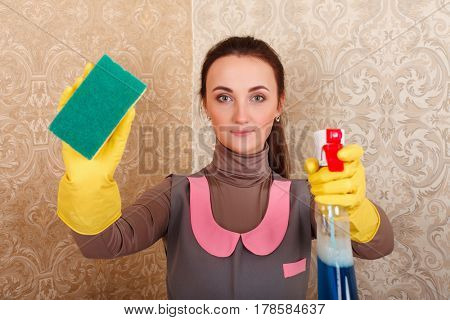 Cleaning servisce lady in rubber gloves