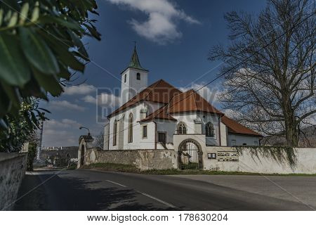 Church In Valtirov Village Near Main Road In Spring Sunny Day
