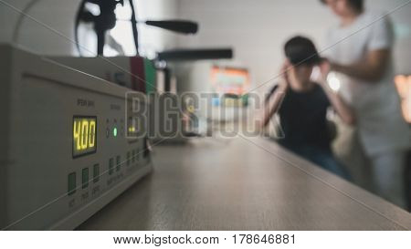 Ophthalmology doctor checks the child's vision with the help of stereovideo virtual reality glasses - de-focused, wide angle