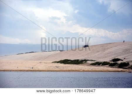 Crokers creek with sand dunes in the background (Belmont - Nine Miles - Beach NSW Australia).