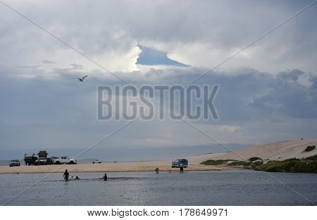 Crokers creek with sand dunes in the background (Belmont - Nine Miles - Beach NSW Australia).