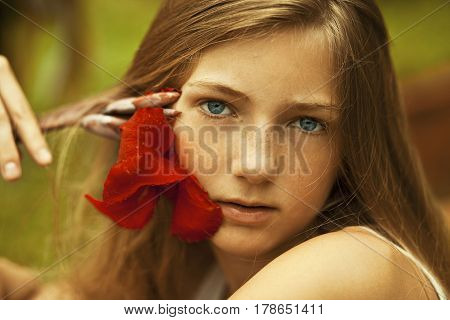 The teen girl with freckles, summer time