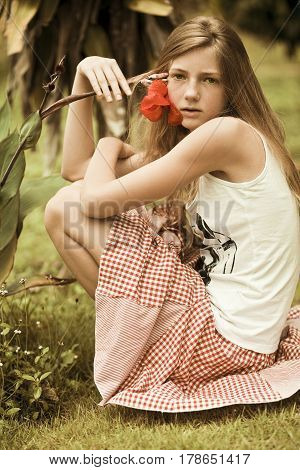 The sensual girl with freckles, summer background