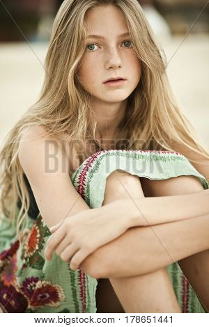 Girl teenager sitting in a chair sensual