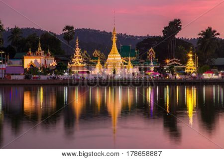 Lake with Wat Chong Klang and Wat Chong Kham temples on sunset, Mae Hong Son, Thailand