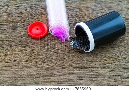 Close up capillary tube with blood lancet Medical equipment on wooden backgroundselective focus.