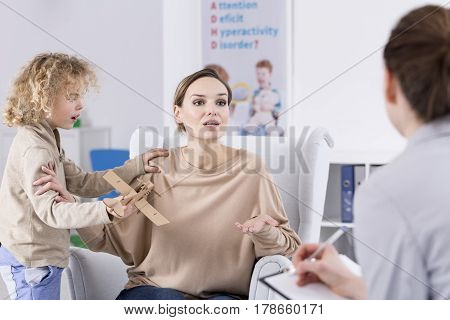 Boy Diverting His Mother Attention