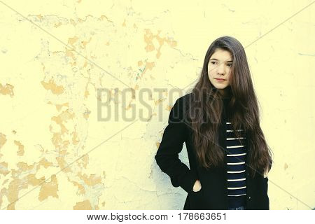 Teen Fashion Girl In Black Coat And Long Brown Hair Street