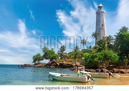 White lighthouse Dondra Head and tropical palms Sri Lanka near Matara.