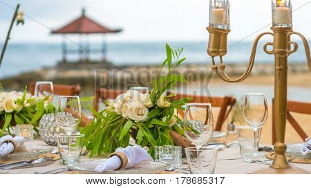 Close up of Table decoration in the Restaurant on the Beach. Bali