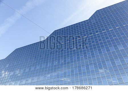 utrecht netherlands 15 march 2017: glass facade of rabobank head office in dutch town reflects clouds and blue sky
