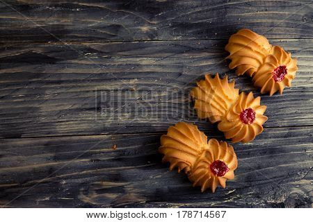 Cookies kurabe on a wooden table in a rustic style.