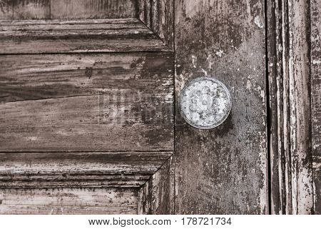 An old vintage wooden door and iron knob