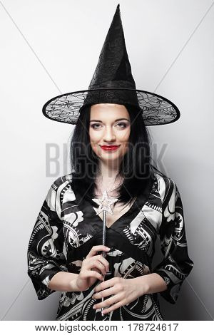 Funny Witch. Young happy woman with canival hat.