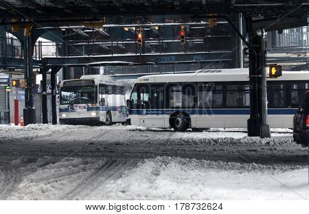 BRONX NEW YORK - MARCH 14: MTA buses ride during snow storm. Taken March 14 2017 in New York.