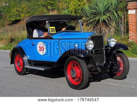 Mignanego Italy - September 25th 2015 - Reenactment 18th Pontedecimo Giovi: The Fiat 504 Spider 1930 conducted by Giorgio Poli during a timed regularity 'test.