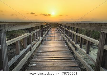 Wooden bridge with sunset sky in twilight at Sam Roi Yot National ParkThailand