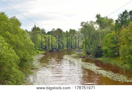 Strelka River at summer in Strelna on the outskirts of St. Petersburg at cloud summer day.