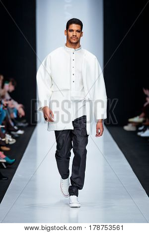 MOSCOW RUSSIA - MARCH 15 2017: Model walk runway for DESIGNER NIKOLAY LEGENDA catwalk at Fall-Winter 2017-2018 at Mercedes-Benz Fashion Week Russia. Men's fashion.