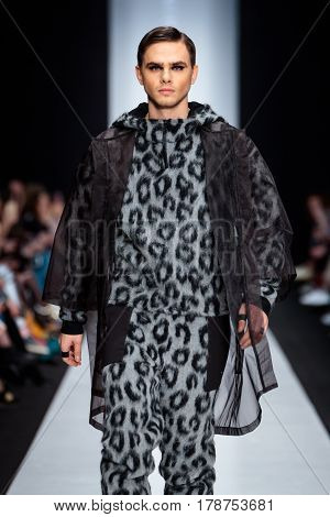 MOSCOW RUSSIA - MARCH 15 2017: Model walk runway for DESIGNER NIKOLAY LEGENDA catwalk at Fall-Winter 2017-2018 at Mercedes-Benz Fashion Week Russia. Men's fashion.