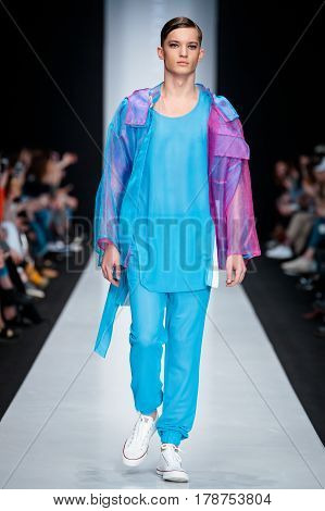 MOSCOW RUSSIA - MARCH 15 2017: Model walk runway for DESIGNER NIKOLAY LEGENDA catwalk at Fall-Winter 2017-2018 at Mercedes-Benz Fashion Week Russia. Men's fashion.