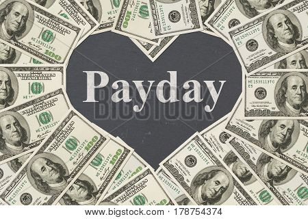 The love payday message One hundred dollar bill in the shape of a heart with a chalkboard heart with text Payday