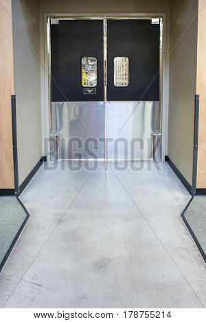 Illuminated modern black door with aluminum in store