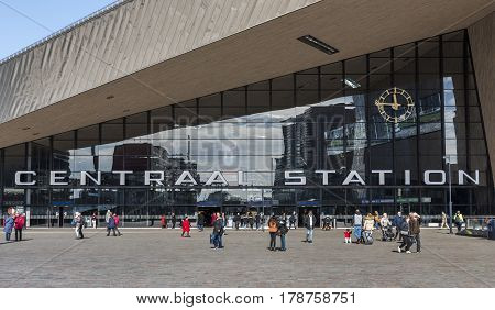Rotterdam The Netherlands - March 10 2017: Modern railway station by architect MVSA in Rotterdam with square and travelers in the Netherlands.