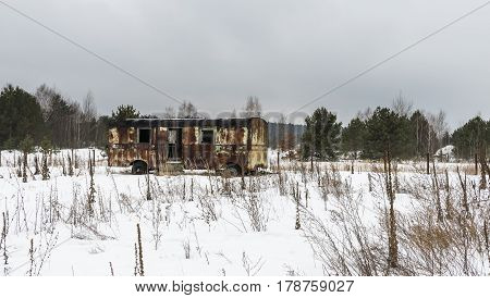 Rusty metal caravan in Chernobyl in the Exclusion zone in the Ukraine in wintertime.