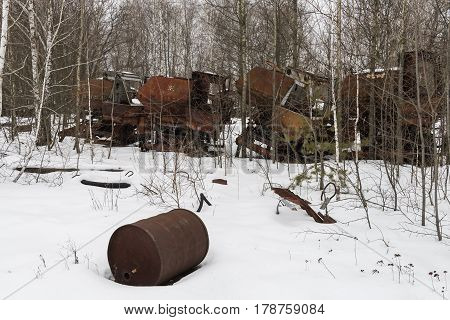 Rusty metal threshers in Chernobyl in the Exclusion zone in the Ukraine in wintertime.