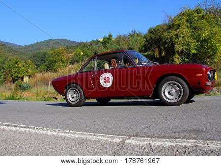 Mignanego Italy - September 25th 2015 - Reenactment 18th Pontedecimo Giovi: The Lancia Fulvia 1300's conducted by Frola-Cantatore during a timed regularity 'test.