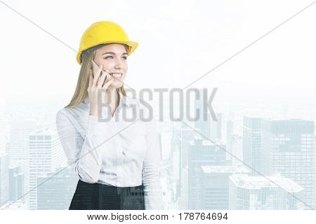 Woman In Hardhat And A City