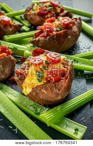 hot baked sweet potato stuffed with bacon, cheddar cheese, cherry tomatoes, balsamic vinegar, cress salad and parmesan sprinkle. Tacco, burrito style