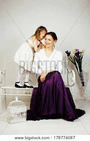 young mother with daughter at luxury home interior vintage, old fashion relashionship family