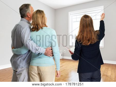 Senior couple with realtor