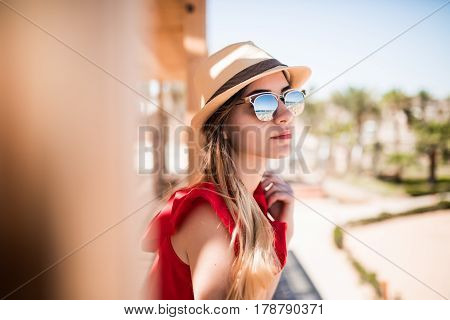 Portrait Of Sunny Girl Relaxing On Summer Sun Wearind In Hat And Sunglasses. Summer Vocation.