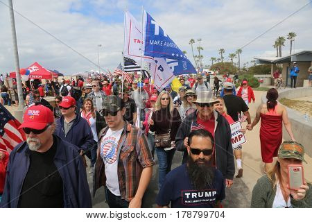 Huntington Beach, CA - March 25 2017: Make America Great Again March. Thousands of Supporters of republican president Donald Trump, wave flags, signs and march at a MAGA March in Huntington Beach. 

