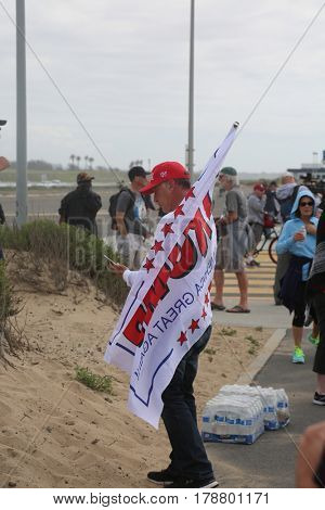 Huntington Beach, CA - March 25 2017: Make America Great Again March. Thousand of Supporters of republican president Donald Trump, march and wave flags, at a MAGA March in Huntington Beach. 




