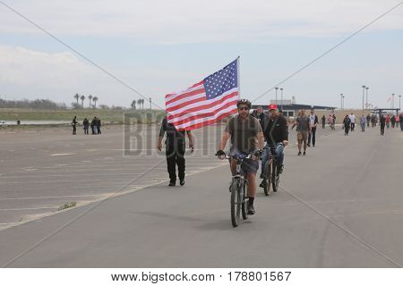 Huntington Beach, CA - March 25 2017: Make America Great Again March. Thousand of Supporters of republican president Donald Trump, wear T-Shirts march and wave flags, at a MAGA March. 




